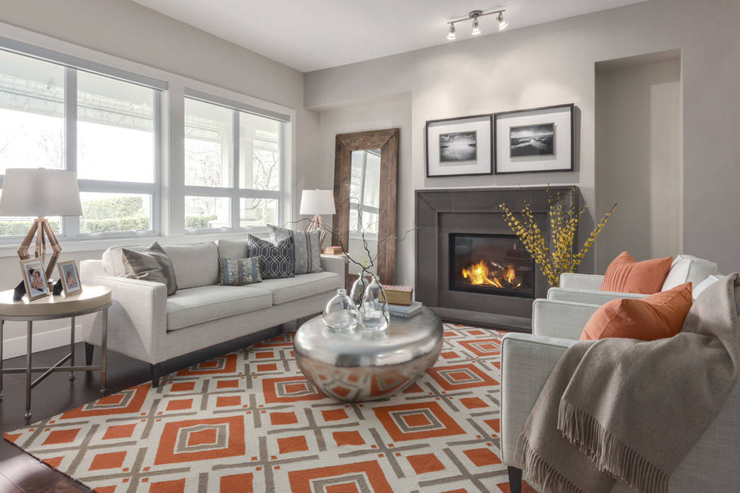 Living room with orange geometric rug
