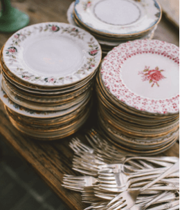 stacked-vintage-plates-on-rustic-table